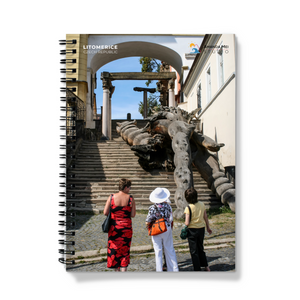 a spiral notebook with a picture of a woman and two children