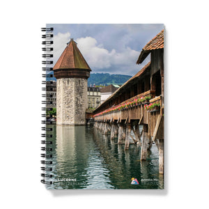 a spiral notebook with a picture of a bridge