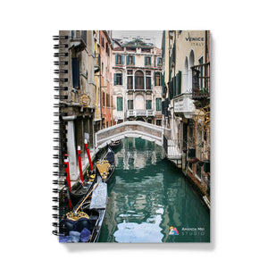 a gondola on a canal in venice, italy spiral notebook