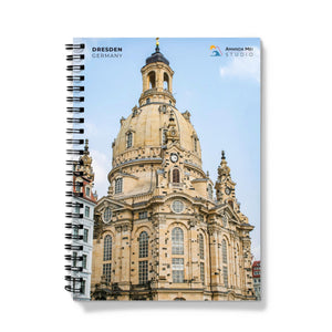 a spiral notebook with a picture of a building