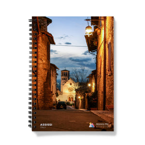 a spiral notebook with an image of a street at night